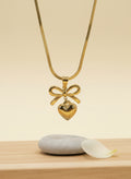 Bow with heart chain pendent